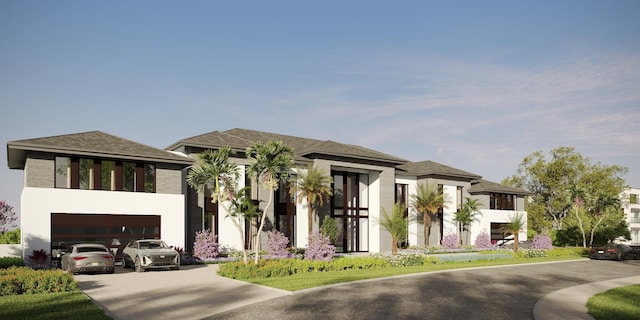 view of front of house with concrete driveway, an attached garage, and stucco siding