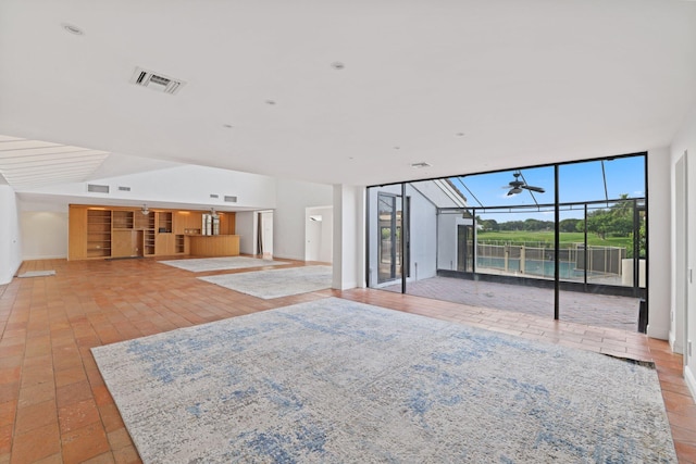 unfurnished living room featuring ceiling fan