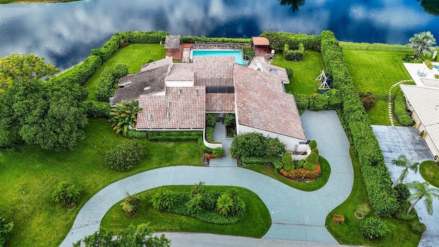 birds eye view of property with a water view