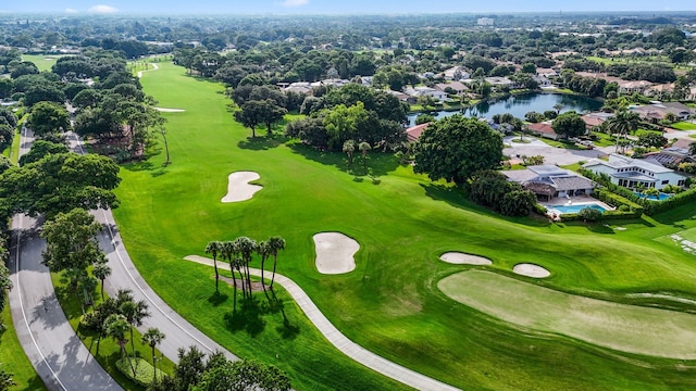 aerial view featuring view of golf course and a water view