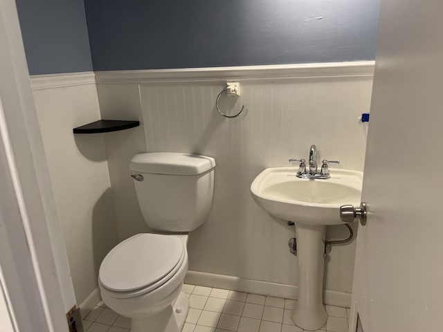 bathroom featuring toilet and tile patterned floors