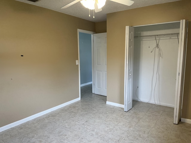 unfurnished bedroom with a closet, ceiling fan, and a textured ceiling