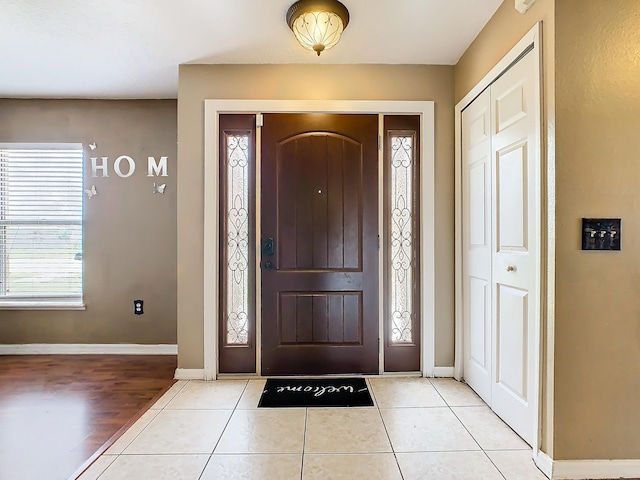 foyer entrance featuring light tile patterned floors