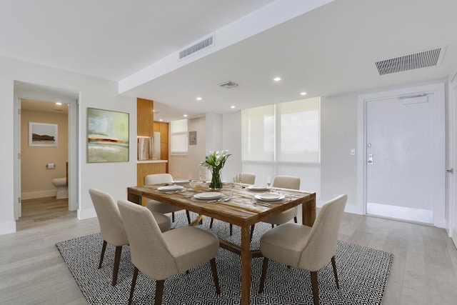 dining area with light hardwood / wood-style flooring