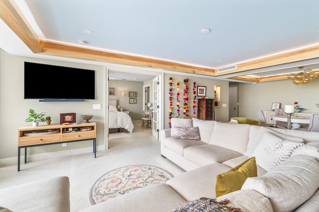 living room with a tray ceiling