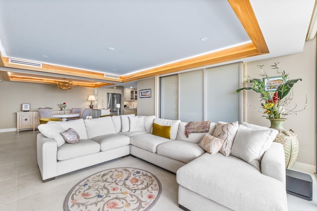 living room with a raised ceiling