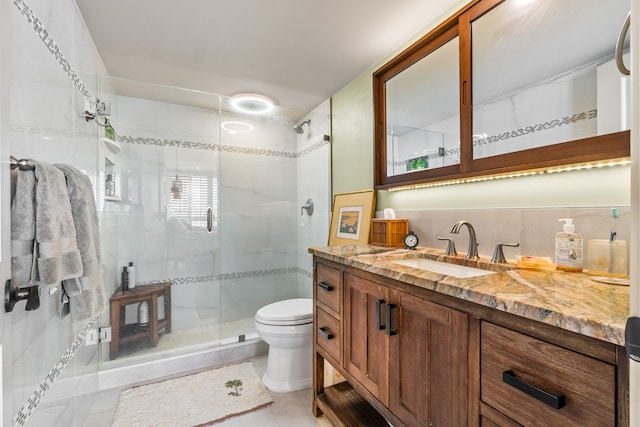 bathroom with vanity, walk in shower, tile patterned flooring, toilet, and decorative backsplash