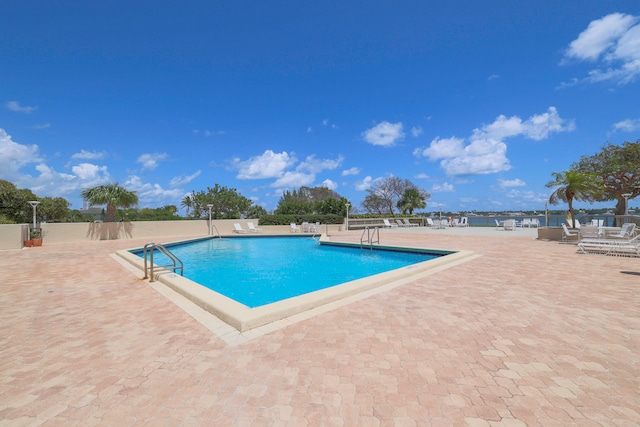 view of swimming pool featuring a patio