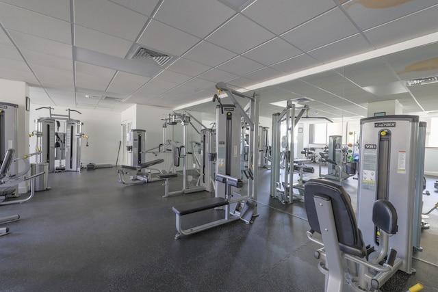 exercise room featuring a paneled ceiling