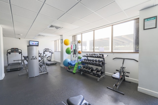 gym featuring a paneled ceiling