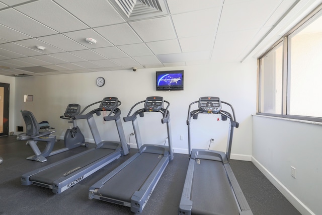 workout area with a paneled ceiling