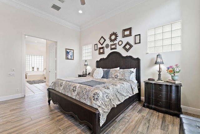 bedroom featuring connected bathroom, ceiling fan, light wood-type flooring, and crown molding