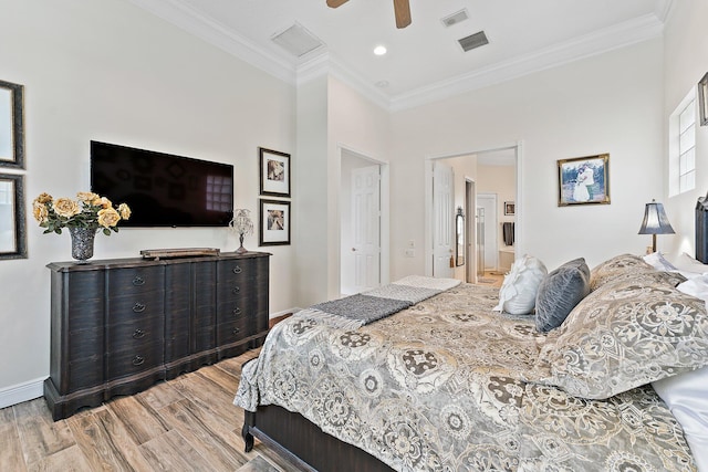 bedroom with ceiling fan, hardwood / wood-style floors, and crown molding