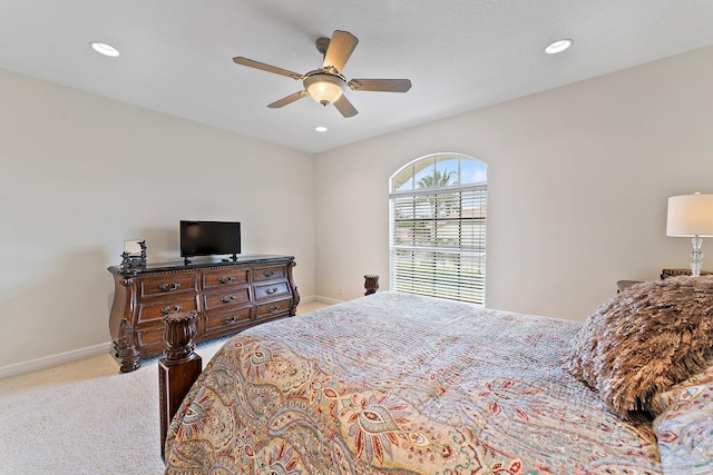 carpeted bedroom featuring ceiling fan