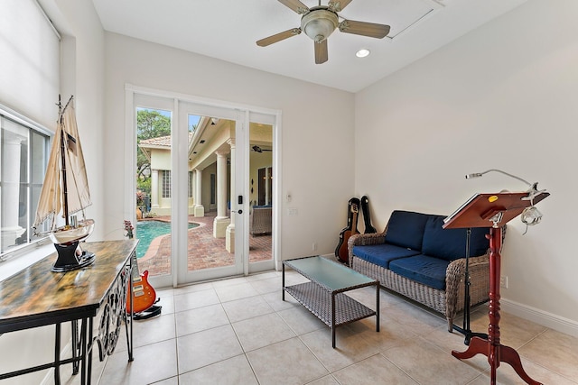 interior space featuring ceiling fan and light tile patterned floors