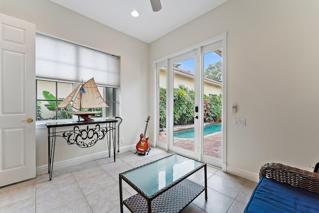 interior space with ceiling fan and light tile patterned floors