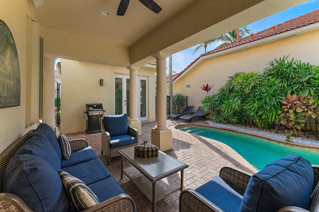 view of patio / terrace with area for grilling, outdoor lounge area, ceiling fan, and french doors