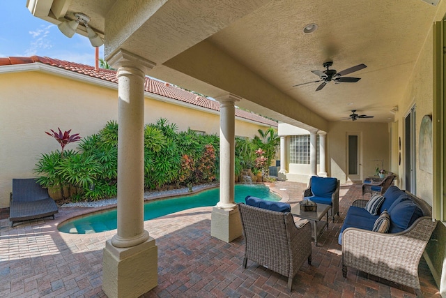 view of patio / terrace with an outdoor living space and ceiling fan