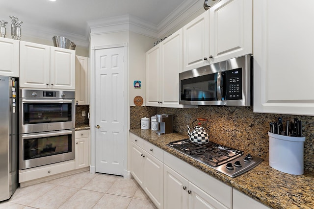 kitchen with crown molding, stainless steel appliances, and white cabinets