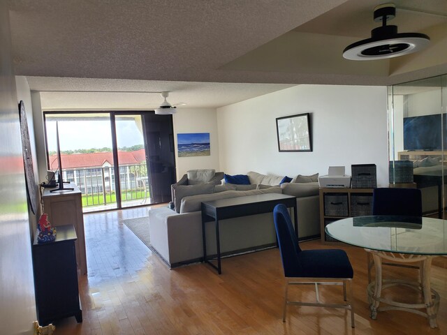 interior space featuring a textured ceiling and hardwood / wood-style flooring