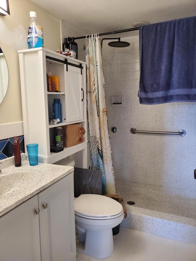 bathroom featuring vanity, toilet, and a shower with curtain