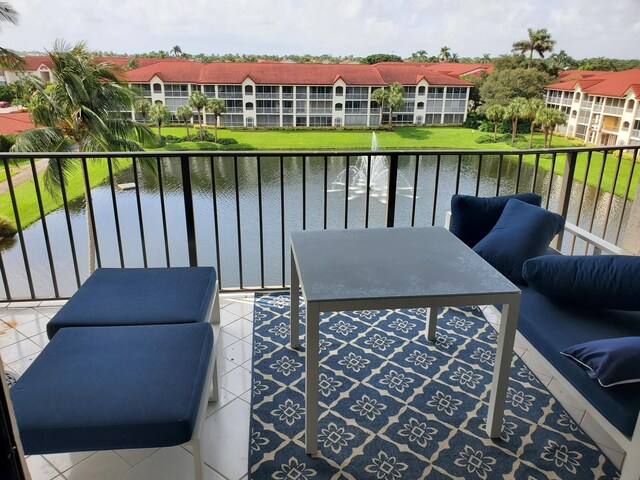 balcony featuring a water view