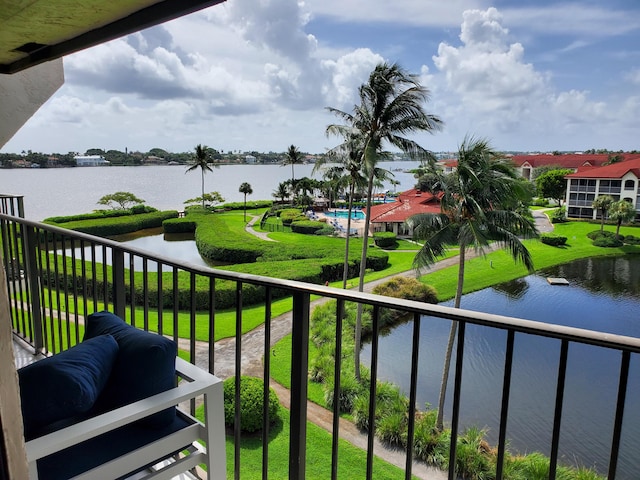 balcony featuring a water view