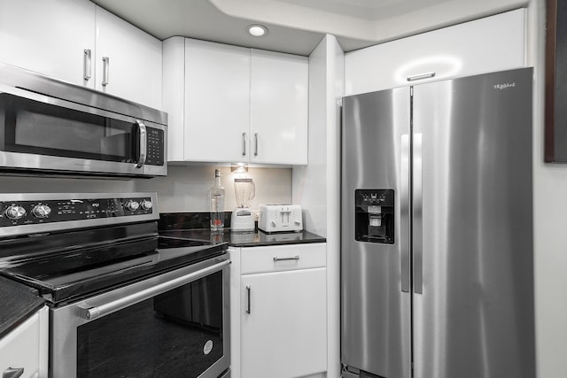 kitchen featuring white cabinetry and stainless steel appliances