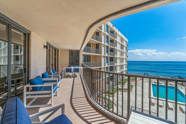 balcony featuring a water view