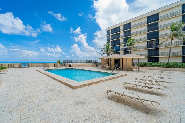 view of swimming pool with a patio area