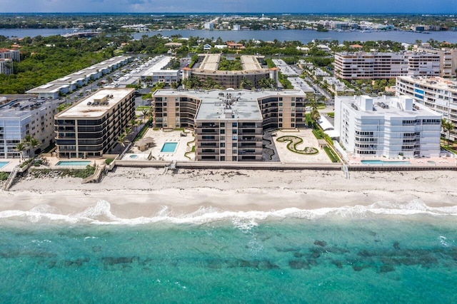 aerial view with a water view and a view of the beach