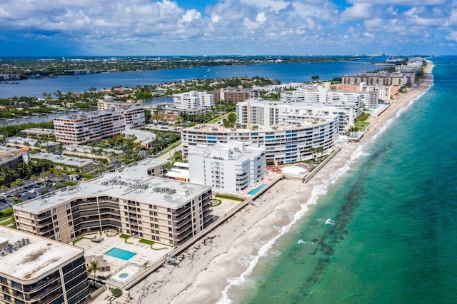 bird's eye view featuring a beach view and a water view