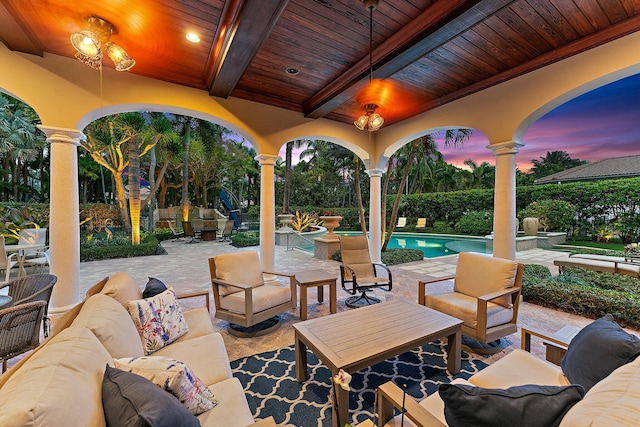 patio terrace at dusk with an outdoor hangout area