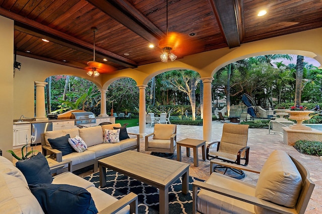 view of patio with area for grilling, a grill, and an outdoor hangout area