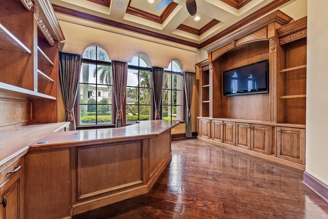 unfurnished office featuring coffered ceiling, dark hardwood / wood-style floors, beam ceiling, ornamental molding, and ceiling fan