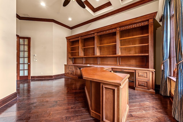 unfurnished office featuring built in desk, coffered ceiling, dark hardwood / wood-style flooring, crown molding, and ceiling fan