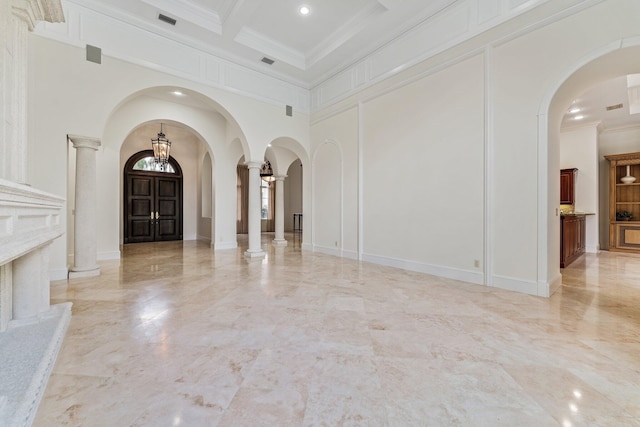 foyer with coffered ceiling, beamed ceiling, decorative columns, crown molding, and a towering ceiling