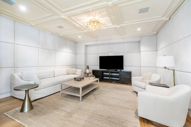 living room with hardwood / wood-style floors, crown molding, coffered ceiling, and beam ceiling