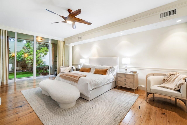 bedroom featuring access to exterior, ceiling fan, light hardwood / wood-style flooring, and ornamental molding