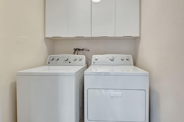 laundry area with cabinets and washer and dryer