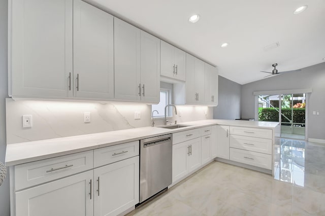 kitchen with backsplash, dishwasher, vaulted ceiling, sink, and ceiling fan