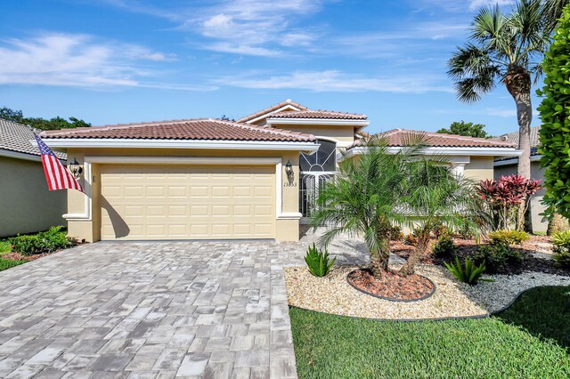 mediterranean / spanish-style home featuring a garage