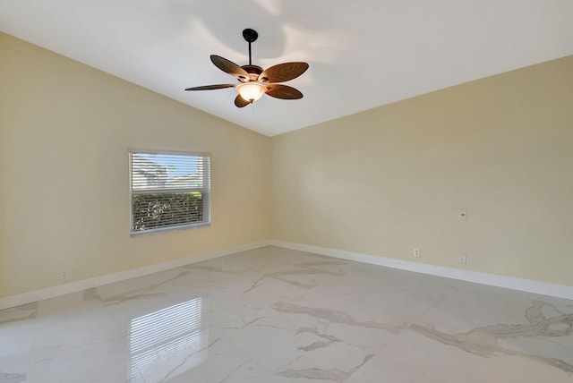 spare room with lofted ceiling and ceiling fan