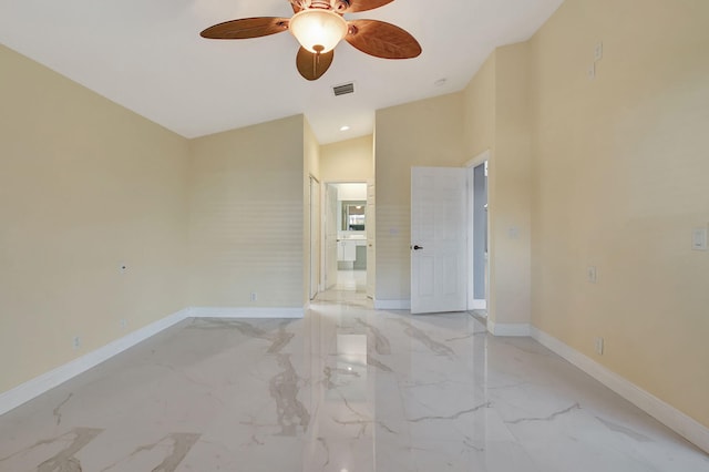 spare room featuring vaulted ceiling and ceiling fan