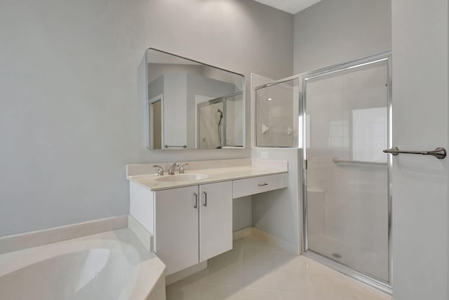 bathroom featuring tile patterned flooring, shower with separate bathtub, and vanity