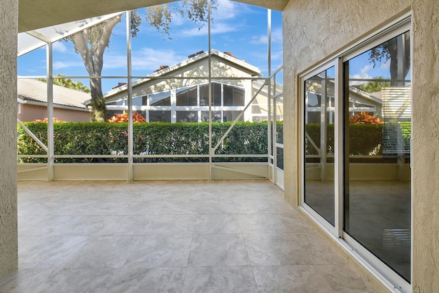 unfurnished sunroom featuring a wealth of natural light