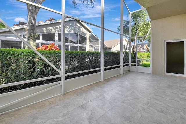 unfurnished sunroom featuring plenty of natural light