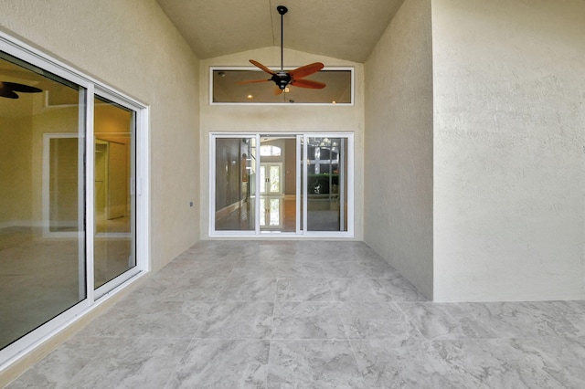 exterior space with ceiling fan