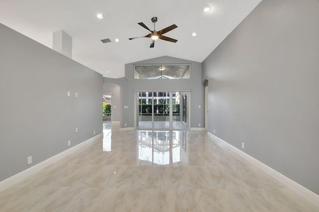 unfurnished living room with high vaulted ceiling and ceiling fan