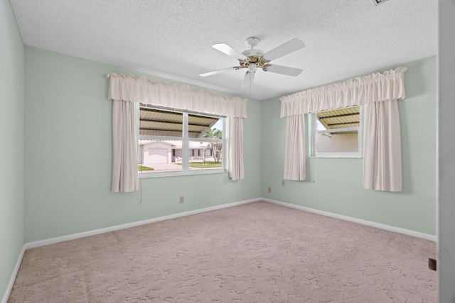 2078 SW 13th Ter, Boynton Beach, FL 33426 - unfurnished room with ceiling fan, carpet flooring, a textured ceiling, and baseboards